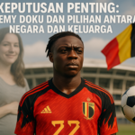 alt_text: Jeremy Doku, bintang Euro, berdiri dengan bangga didukung oleh keluarganya.