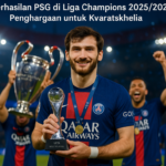 alt_text: Kvaratskhelia merayakan kemenangan dengan mahkota Liga Champions baru di kepalanya.